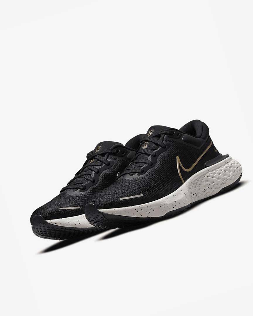 Black / Metal Gold Men's Nike ZoomX Invincible Run Flyknit Running Shoes | UK2385